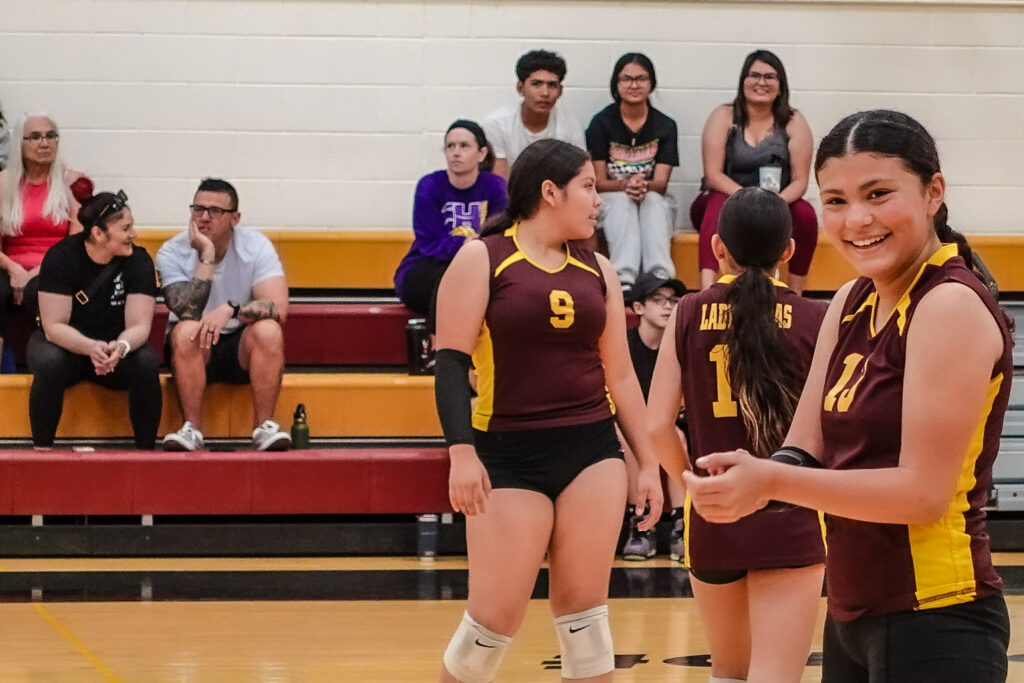 Ten volleyball players.