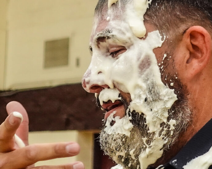 Man after being hit in the face with a whipped cream pie.